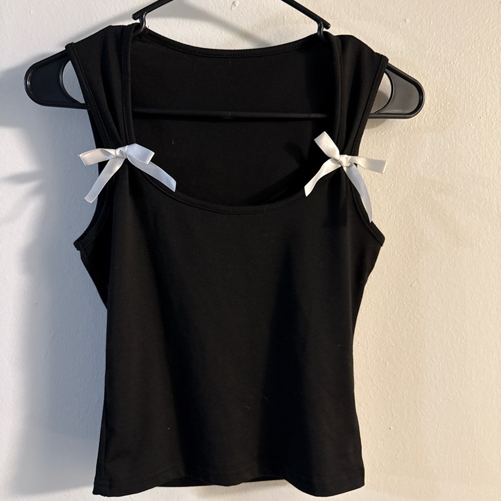 Black Sleeveless Top with White Bows